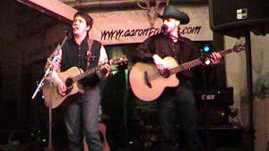 Aaron and Jim performing with acoustic guitars at Buster's Saloon in Sun City, in south-central Kansas