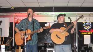 Aaron Traffas Band acoustic performing with guitars at Neighbar's in Hays, in central Kansas