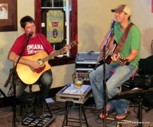 Aaron Traffas performing with acoustic guitar at Buster's Saloon in Sun City, in south-central Kansas