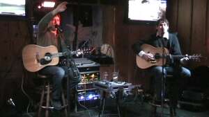 Aaron Traffas Band performing with acoustic guitars at Bobby T's Bar and Grill in Manhattan, in northeast Kansas