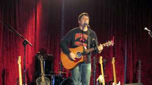 Ryan Tittsworth Band performing with acoustic guitar at America's Pub in Wichita, in south-central Kansas