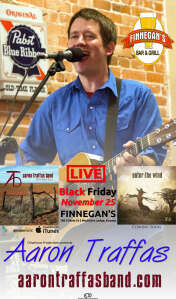 Aaron Traffas singing with acoustic guitar at Finnegan's Bar and Grill in Medicine Lodge, in south-central Kansas