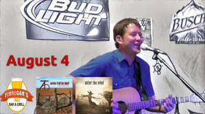 Aaron Traffas singing with acoustic guitar at Finnegan's Bar and Grill in Medicine Lodge, in south-central Kansas
