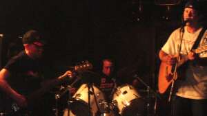 Aaron Traffas, Mason Powell, and Roger Powell performing at Dave's Bar in Kiowa, in south-central Kansas