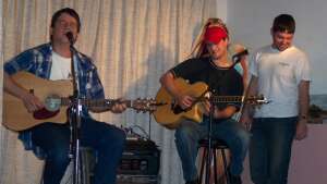 Trevor Burgess, Aaron Traffas, and Dusty Feighner performing at Buster's Saloon in Sun City, in south-central Kansas
