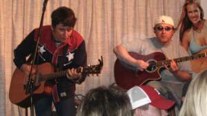 Aaron Traffas and Mike Kisner performing with acoustic guitars at Buster's Saloon in Sun City, in south-central Kansas