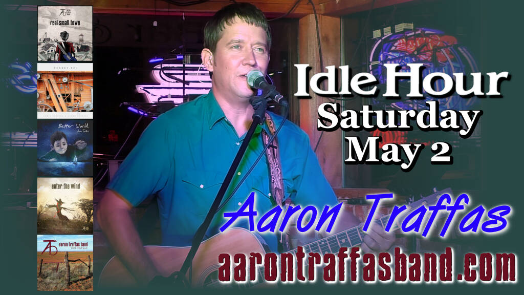 Aaron Traffas singing with acoustic guitar at Idle Hour in Anthony, in south-central Kansas