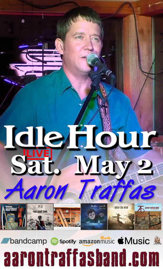 Aaron Traffas singing with acoustic guitar at Idle Hour in Anthony, in south-central Kansas