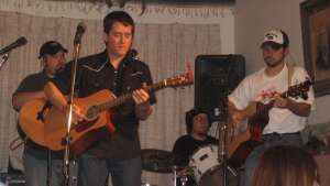 Aaron Traffas Band performing with acoustic guitars at Buster's Saloon in Sun City, in south-central Kansas